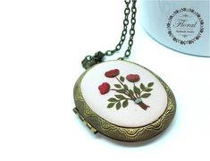 This is a romantic style, handmade, polymer clay photo locket necklace with wildflower motifs. This beautiful personalized locket necklace is a piece of original and unique artwork. This pink peony or rose flower locket is a perfect gift ideas for women. The method is known as 'appliqued technique'. Using tiny pieces of clays and a sharp needle. I don't use molds to prepare my locket necklaces. Each small parts of the motifs are made by hand and placed one by one on the background with a needle. Vintage Flower Charm Necklace For Gift, Flower Shaped Necklace With Vintage Charm As Gift, Flower Shaped Necklace With Vintage Charm For Gift, Personalized Pink Locket Necklace For Gift, Personalized Pink Locket Necklace Gift, Pink Medallion Jewelry Gift, Pink Medallion Jewelry As A Gift, Pink Medallion Jewelry For Gifts, Mother's Day Flower Pendant Locket Necklace Gift