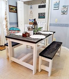 a kitchen table with two benches in front of it