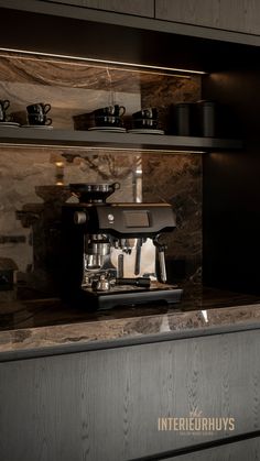 an espresso machine sitting on top of a counter