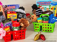 two baskets filled with toys on top of a wooden table next to other items in the basket