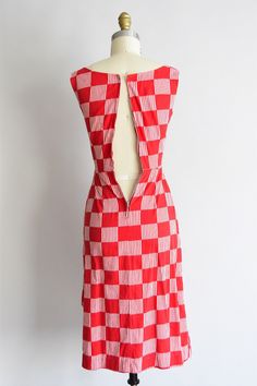 "Vintage 1950s cotton daydress. Red check and white striped check design. Scoop collar, darted bust, 2\" shoulder straps, nipped waist, sarong-like detail at hip. Back metal zipper closure. State of garment | excellent. Measurements ✂--- best fit | XXS bust | 30 \" shoulders | not specified shoulder to waist | 13.5\" sleeves | not specified waist | 22 \" hips | up to 38\" total length (shoulder to hem) | 38\" tag | none present ★★Visit The Shop★★ http://www.etsy.com/shop/seaofvintage ➸ Find the 1950s Gingham Cotton Dresses, 1950s Plaid Summer Dresses, 1950s Style Plaid Summer Dresses, Vintage Black Cocktail Dress, Wine Dress, Peach Dress, Cheque Design, Paisley Dress, Black Cocktail Dress