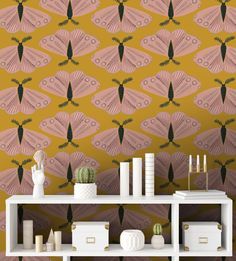 the wallpaper in this room is designed with pink and black fan shaped designs on yellow background