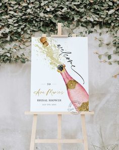 an easel with a champagne bottle on it