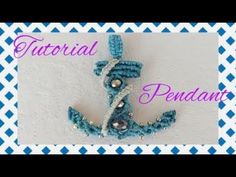 an anchor made out of beads on a blue and white checkered background with the words,