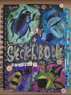 a sketch book with buttons and writing on it