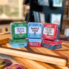 four boxes of family time soap sitting on top of a wooden table next to doughnuts