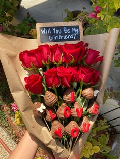 a bouquet of red roses and chocolate covered strawberries with the words will you be my girlfriend written on it