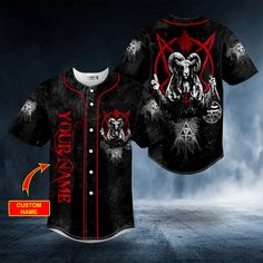 a black baseball jersey with red and white designs on the front, featuring an image of a demon