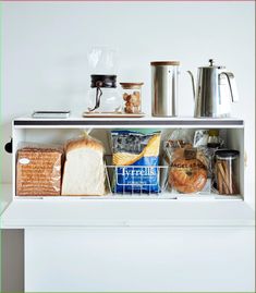 a shelf filled with bread and other items