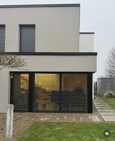 a modern house with large sliding glass doors