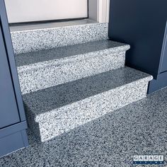 the steps are made of granite and have blue trimmings on each one side