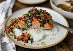 a white plate topped with rice and vegetables