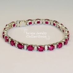 Thank you for coming in!Beautiful red ruby diamond tennis link bracelet! There are 21 high quality red rubies totaling 13.7 carats separated by rectangle shape diamonds totaling 1.72 carats!Total Weight: 17.21 gramsSize: 6.3 inch braceletPrecious Metal: 18k yellow goldPrecious stones:-Ruby Ovals: QTY 21, 13.7 carats-Diamonds: QTY: 21, 1.72 caratsHallmark: 750, R:137, D172 Luxury Ruby Baguette Cut Jewelry, Red Diamond Bracelet With Gemstone, Classic Ruby Diamond Bracelet, Classic Round Ruby Diamond Bracelet, Red Luxury Diamond Bracelet, Luxury Red Diamond Bracelet, Luxury Red Diamond Tennis Bracelet, Red Diamond Bracelet Fine Jewelry, Red Diamond Bracelet In Fine Jewelry Style