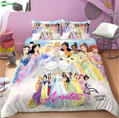 a bed with disney princesses on it in a bedroom next to a pink wall