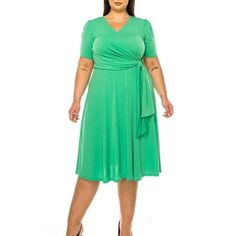 Product Description: Step into elegance with the Plus Size Stylish Solid Faux Wrap Dress featuring a Deep V-Neck. This chic and sophisticated dress is designed to flatter your curves while providing ultimate comfort. The faux wrap design creates a beautiful silhouette, and the deep V-neck adds a touch of allure. Crafted from high-quality, stretchable fabric, this dress is perfect for any occasion, from casual outings to formal events. Available in a range of solid colors, it's a versatile additi Plus Size Flowy Dress, Black Plus Size Dress, Casual Sundress, Moa Collection, Plus Size Summer Dresses, Beautiful Silhouette, Dot Print Dress, Evening Dresses With Sleeves, Loose Maxi Dress