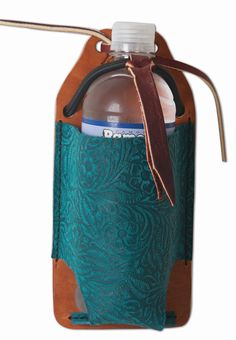 a water bottle in a leather case