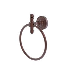 an old fashioned toilet paper holder with a towel ring