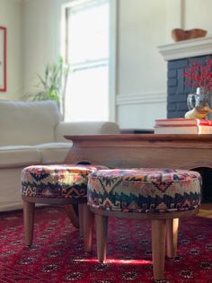 a living room filled with furniture and a fire place