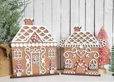 two gingerbread houses sitting next to each other