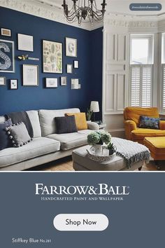 a living room with blue walls and yellow furniture in it, the color is farrow & ball