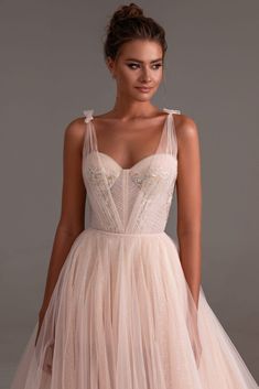 The delicate ball tulle dress is in peach color. Fitted at the bust, features an embellished lace-up corset and built-in cups; a semi-transparent overlay tulle skirt, and a matching short pink underskirt. The dress has a train in length of 200 cm from the waistline approximately. DETAILS Material: Tulle; Hand embroidery Fabric Composition: 100% polyester Sleeves style: Tie straps Silhouette: A-line Skirt length from waist: 45.2 inches / 115 cm Dress weight: 2.64 lbs / 1.2 kg Neckline: Heart-shap Bridal Dress Beach Wedding, Princess Bride Dress, Layered Gown, Colored Wedding Dress, Princess Bridal Gown, Boho Wedding Dress Lace, Occasion Dresses Wedding, Sweetheart Prom Dress, Tulle Gown