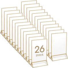 PRICES MAY VARY. Package including: the package includes 26 pieces acrylic sign holders with gold border, can display 5 x 7 inch documents or pictures, sufficient quantity can fully display any items you want to display; This gold menu holder combines modern glam with a touch of romantic vibe, which added a touch of classic elegance to any table Strong Quality: our clear double sided menu holder is made of acrylic, designed with gold edges to add an elegant touch to your tables; It appears to be Gold Table Number Holders, Table Display Stand, Wedding Table Number Holders, Acrylic Picture Frames, Gold Table Numbers, Table Number Holders, Gold Picture Frame, Menu Holders, Acrylic Display Stands