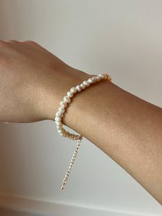 Handmade delicate pearl bracelet! A perfect addition to your every day jewelry collection! Pearl diameter: 4-6 mm Bracelet length: 7 inches (message for guidance on size, if needed) Dainty Handmade Pearl Bracelet, Adjustable Pearl Chain Bangle Bracelet, Pearl Chain Bangle Bracelets, Pearl Bangle Bracelet With Pearl Chain, Adjustable Minimalist Pearl White Bracelet, Minimalist Adjustable Beaded Bracelets With Pearl Chain, Minimalist Adjustable Beaded Bracelet With Pearl Chain, Adjustable Pearl Bracelet With Pearl Chain, Dainty Pearl White Bracelets