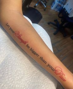 a person with a tattoo on their arm that says, let your story be bigger than your love