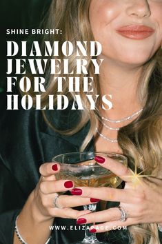 a woman holding a wine glass with diamond jewelry on her hand and the words shine bright