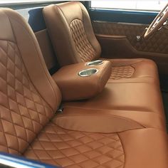 the interior of a car with tan leather seats