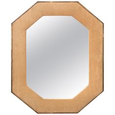 an octagonal mirror with a wooden frame in the shape of a octagon