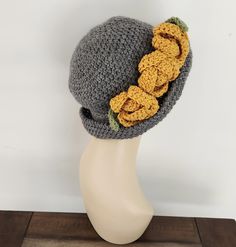 Crochet Womens Hats, Hats Women, Hats, Crochet Women Hats, Crochet Hat, Crochet Hat Women, Winter Hats Women, Crochet Hat For Women. This gorgeous crochet hat made by me inspired flapper style Hat. It is stylish, comfortable,soft and warm. If you need the flowers smaller let me know at the check out. I make this hat fits average adult head 22". If you are not sure which size please measure your around your head just above the ears.   We can easily customize it to fit other sizes as well! If you are interested in an item but would prefer a different size or color  feel free to contact us and we'll try to make it for you. Each flower size 4 inch circumference. Primary color represents the hat and the secondary  color represents the flowers.  Sample colors in the pictures are grey heather hat Crochet Hat Women, Crochet Womens Hat, Women Winter Hats, Hats Crochet, Gorgeous Crochet, Crochet Women, Crochet Hat For Women, Womens Hats, Hat Fits