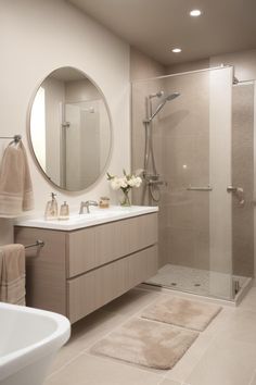 a bathroom with a sink, mirror and shower in it's center area is shown