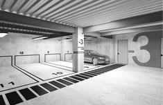 a car is parked in an empty parking garage with numbered numbers on the wall and floor