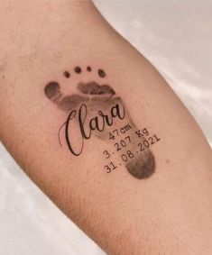 a close up of a person's arm with a tattoo on it that says clara