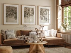 a living room filled with furniture and pictures hanging on the wall above it's coffee table