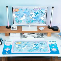 a desk with a computer monitor, keyboard and mouse pad sitting on top of it