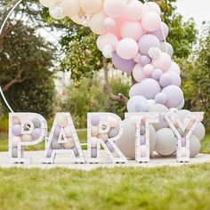 a party sign with balloons in the shape of letters that spell out'party '