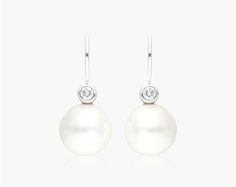 18K White Gold South Sea Cultured Pearl and Bezel Diamond Drop Earrings (11.0-12.0mm). This elegant pair of drop earrings features beautiful 11.0 to 12.0 mm South Sea pearls with bezel set diamonds for a timelessly luxurious look. Elegant Teardrop Bezel Set Earrings, White Bezelled Wedding Earrings, Elegant Bezel-set Drop Earrings, Elegant Bezel Set Drop Earrings, Luxury Formal Earrings With Bezel Setting, Bezel Set Diamond, South Seas, South Sea Pearls, Sea Pearls