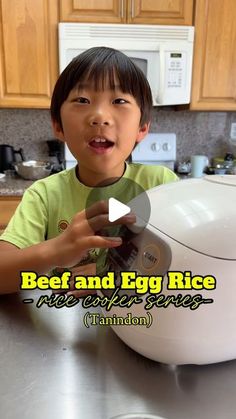 a young boy is holding an egg cooker