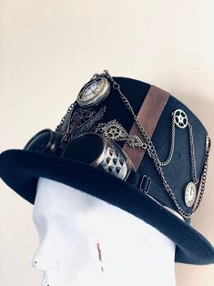 Our brown/black steampunk hat with goggles radiates sophistication, join the steampunk revolution and claim your spot among the fashion-forward. Perfect for themed events, cosplay, or adding a dash of steampunk to your everyday attire.


Age Group/Gender - Adult/Unisex

Size/Type - One size fits all adults
Color - Brown/Black Steampunk Brimmed Halloween Costume Hat, Vintage Brimmed Costume Accessories, Steampunk Brimmed Costume Hats For Themed Events, Steampunk Top Hat With High Crown For Themed Events, Steampunk Brimmed Costume Accessories For Party, Steampunk Brimmed Costume Hat For Cosplay, Steampunk Costume Accessories With Brimmed Shape, Steampunk Brimmed Costume Accessories For Costume Party, Steampunk Brimmed Hat For Themed Events