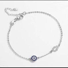 Brand New Gorgeous Lucky Evil Eye Bracelets For Women 925 Sterling Silver Bracelet Blue Eye Hamsa Hand Fatima Hand Authentic 925 Sterling Silver Bracelet /Stamped/ Lead Free, Nickel Free Main Stone Aaa Cubic Zirconia Weight 10g Length 6” + 1.5” Extension (7.5”) Charm Size (Eye) 0.7cm, (Hand)1cm Beautiful And Delicate Would Make Great Gift This Holiday Season Elegant Evil Eye Bracelet With Adjustable Chain, Elegant Blue Sterling Silver Charm Bracelet, Elegant Evil Eye Bracelet, Elegant Blue Sterling Silver Evil Eye Bracelet, Elegant Sterling Silver Evil Eye Bracelet, Elegant Silver Adjustable Evil Eye Bracelet, Elegant Adjustable Silver Evil Eye Bracelet, Elegant Blue Sterling Silver Chain Bracelet, Elegant Silver Evil Eye Bracelet