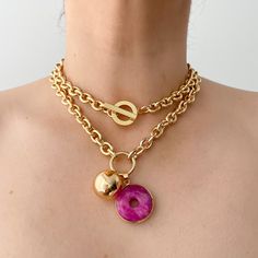 D E T A I L S     * This minimalist Unique purple dyed jade pendant will make a statement with any of your outfit. Perfect for layering. * 18K gold plated stainless steel. Tarnish resistant. purple donut pendant 1" in diameter. * Available three different style. double pendant, ball pendant or just the donut jade.    Please choose desired finish in the drop down menu.  * Perfect for special gift occasions, Christmas, anniversaries, birthdays, parties, weddings.  * All items packaged in gift read Pendant Ball, Purple Stone Necklace, Chunky Choker Necklace, Purple Dye, Donut Pendant, Chunky Choker, Necklace Purple, Purple Necklace, Jade Necklace