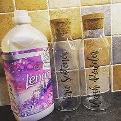 there are three bottles on the counter next to each other, one is labeled lenor