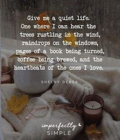 an image of a book and glasses on a blanket with the quote give me a quiet life one where i can hear the trees rusting in the wind, rainbows on the windows,