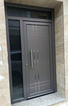 an entrance to a building with a metal door