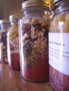 several jars filled with different types of food