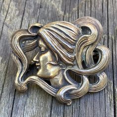 "Details: Lovely Kerr Art Nouveau lady silver brooch. This lovely lady with swirling long hair, is in great condition. It is hallmarked on the inside \"Sterling\", and numbered \"1353\". This is a lovely piece in very good condition. This piece has a nice patina on it, but could also be polished if that is your taste. We have left this how we found it, and have not polished or disturbed the natural antique patina. William Kerr was an American jeweler during the Art Nouveau period in Newark, New Winged Scarab, Art Nouveau Lady, Snake Brooch, Silver Heart Earrings, Egyptian Revival, Gold Engraving, Gold Band Ring, Lovely Ring, Antique Earrings