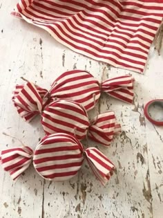 some red and white striped fabric with scissors