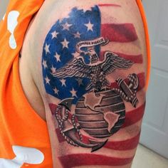 a man with an american flag and eagle tattoo on his arm is wearing an orange shirt